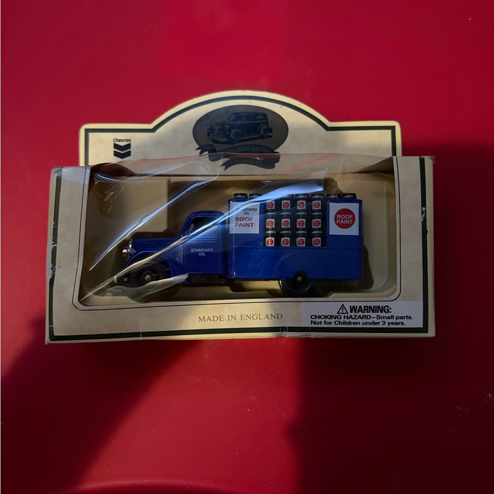 NIB Lledo says gone by chevron roof coating flat bed ornament.